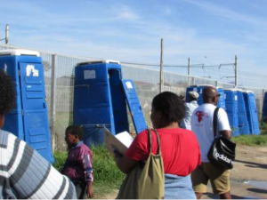 SJC members inspect Mshengu toilets.  Photo courtesy of Sowmya Kidambi